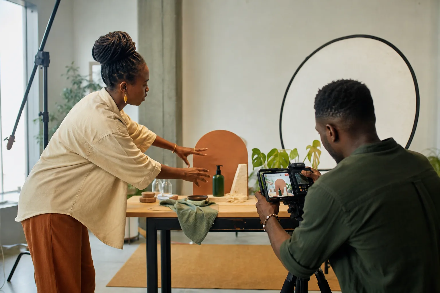 Tanzanian content team directing and filming a product story in a professional studio